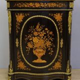 Boulle furniture with a curved shape from the Napoleonic III era in lacquered wood and marquetry.