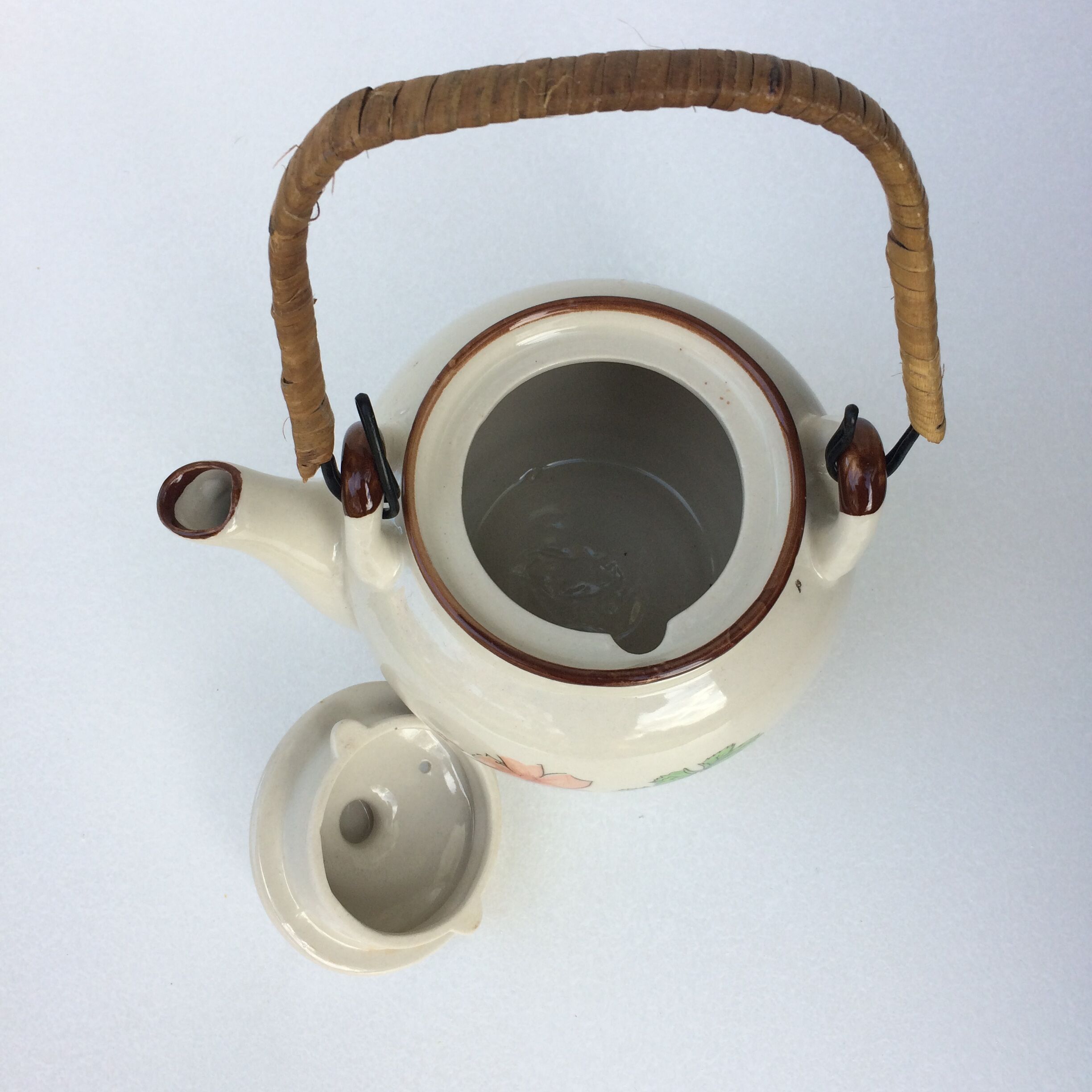 Vintage teapot with wicker handle