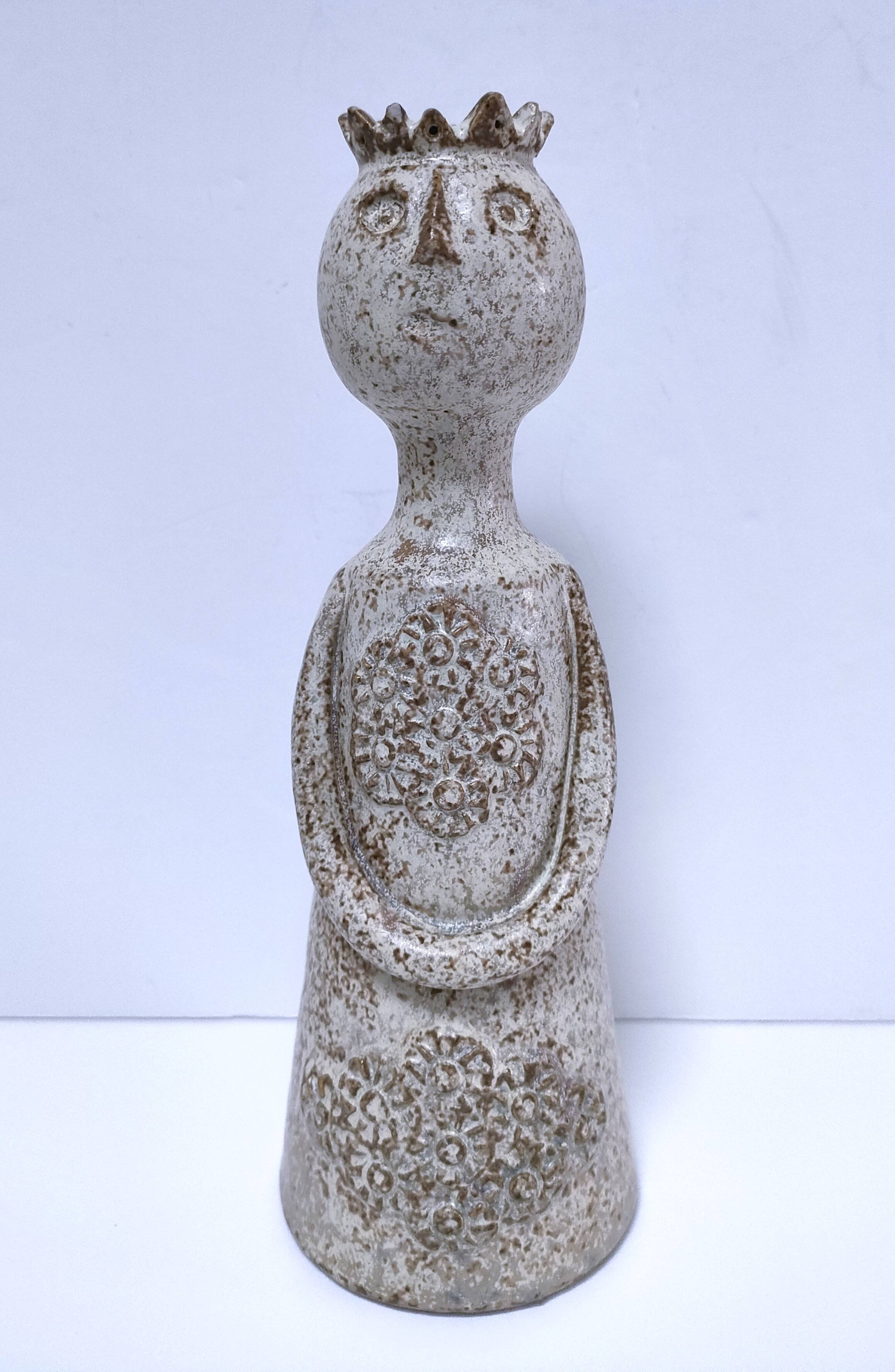 ceramic candle holder with crowned head signed P