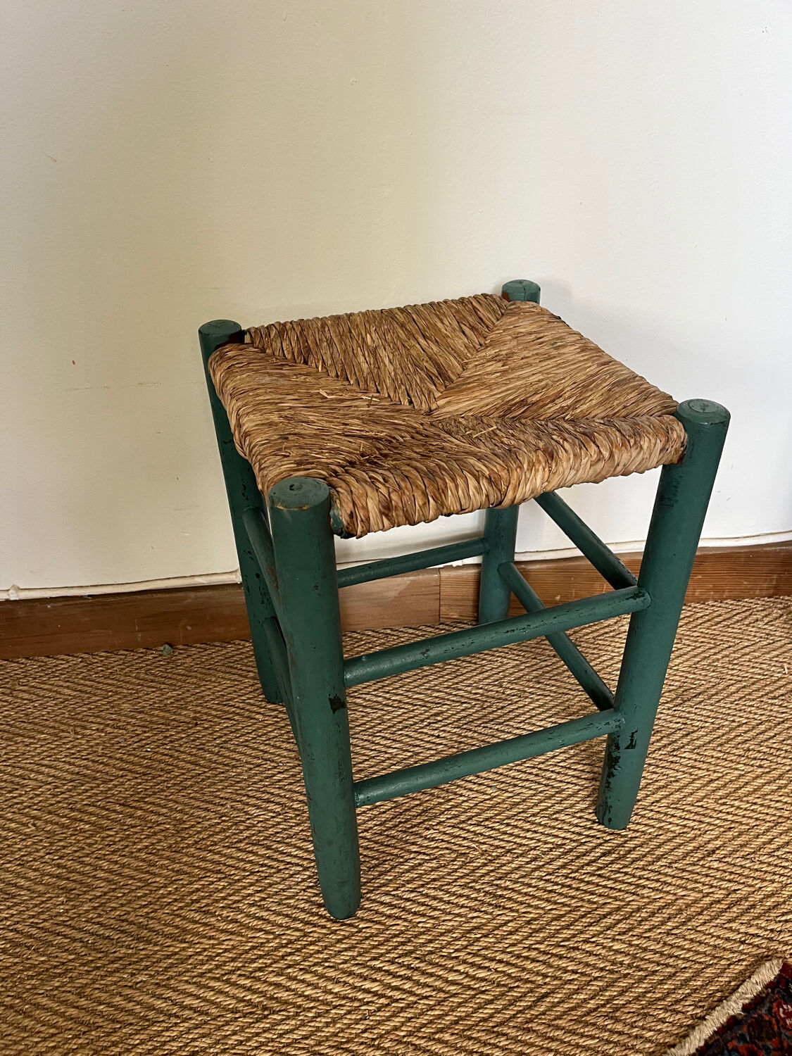 Vintage stool in green patinated wood and straw