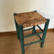 Vintage stool in green patinated wood and straw