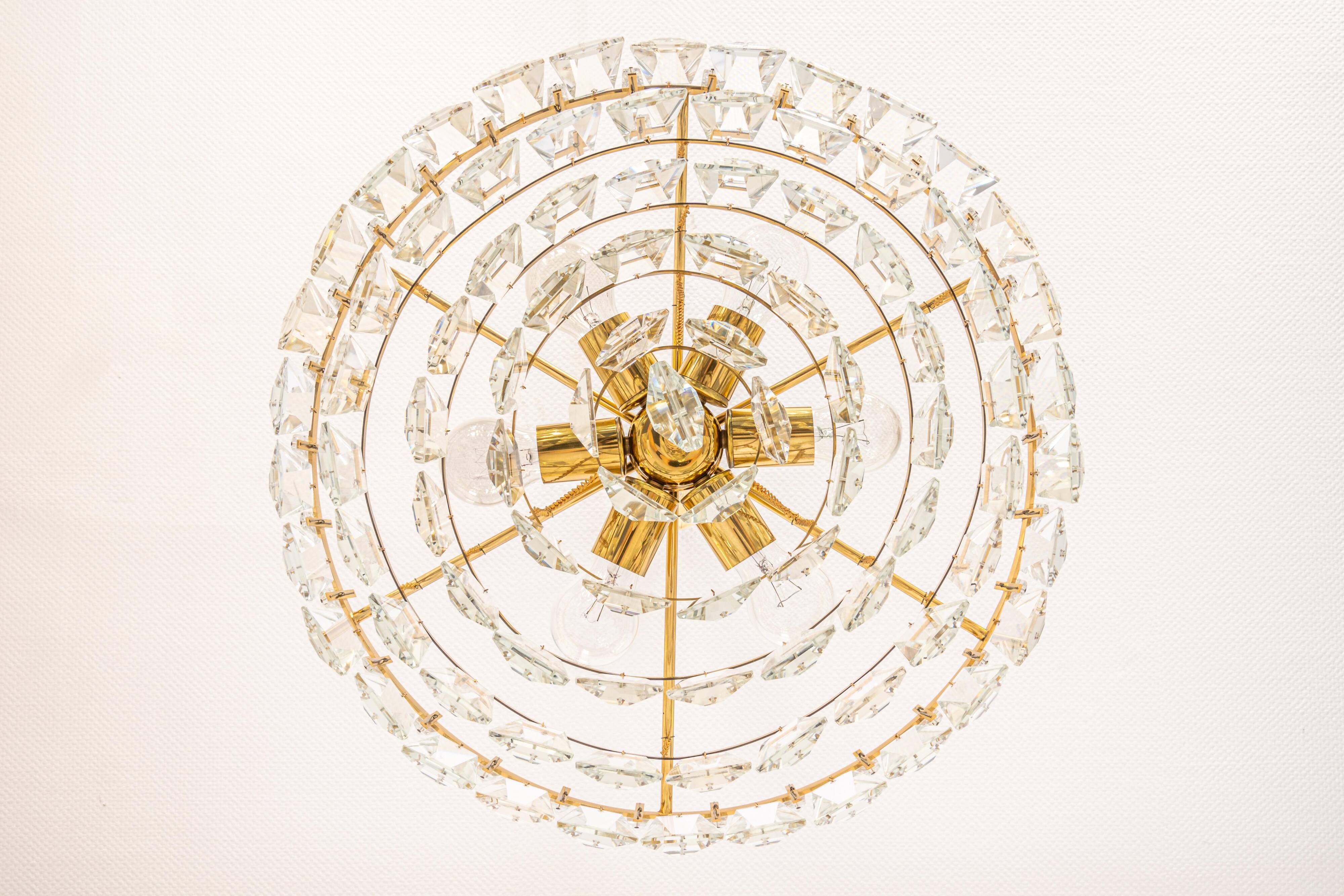 Large chandelier in gilded brass and crystal, by Palwa, Germany, 1970s.