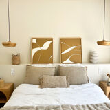 Diptych relief panels with a brown camel and cream background.