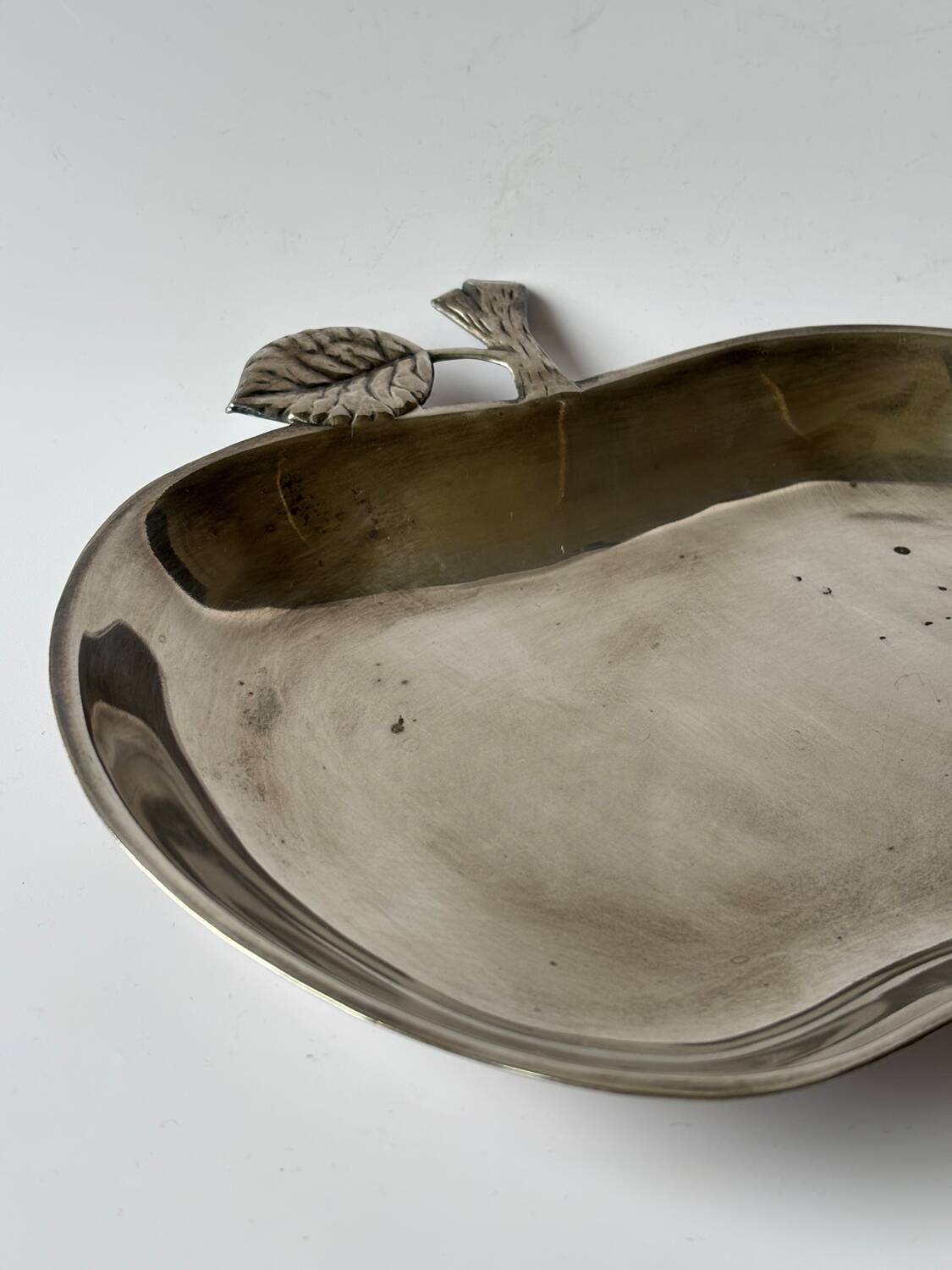 Silver metal apple pocket emptier