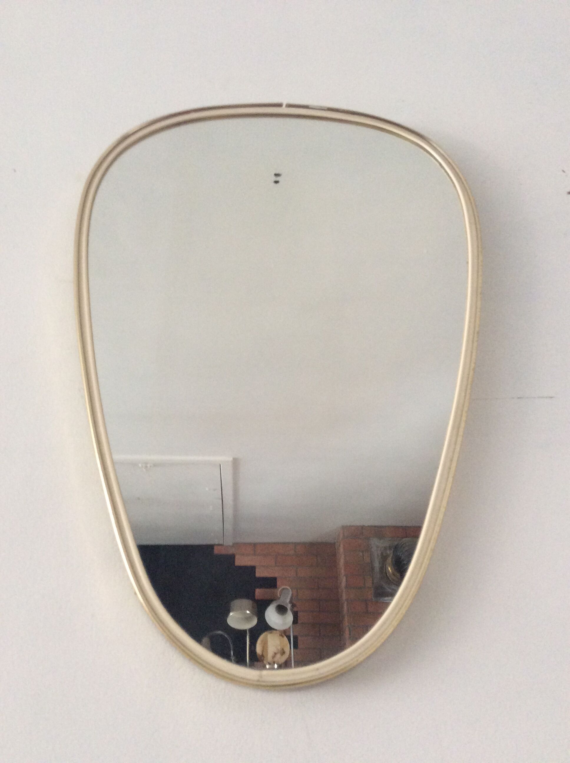 Asymmetrical free-form mirror from the 70s
