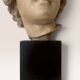 Plaster bust on a wooden base