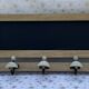 Wall-mounted coat rack with porcelain hooks