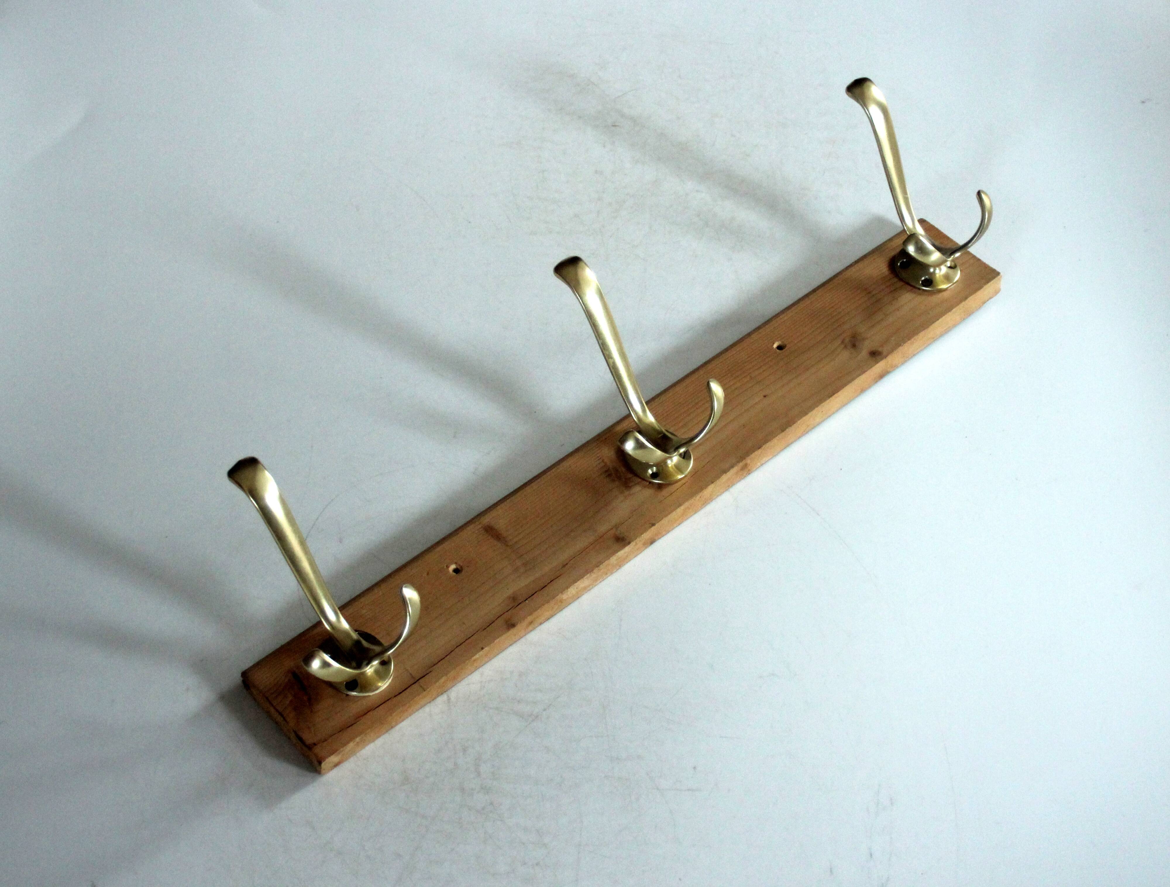 Wall mounted wooden coat rack with 3 brass hooks, vintage from the 50s