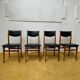 4 Scandinavian chairs in teak and black faux leather.