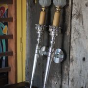 Large pair of silver-plated wall lights with flame globes, torches.