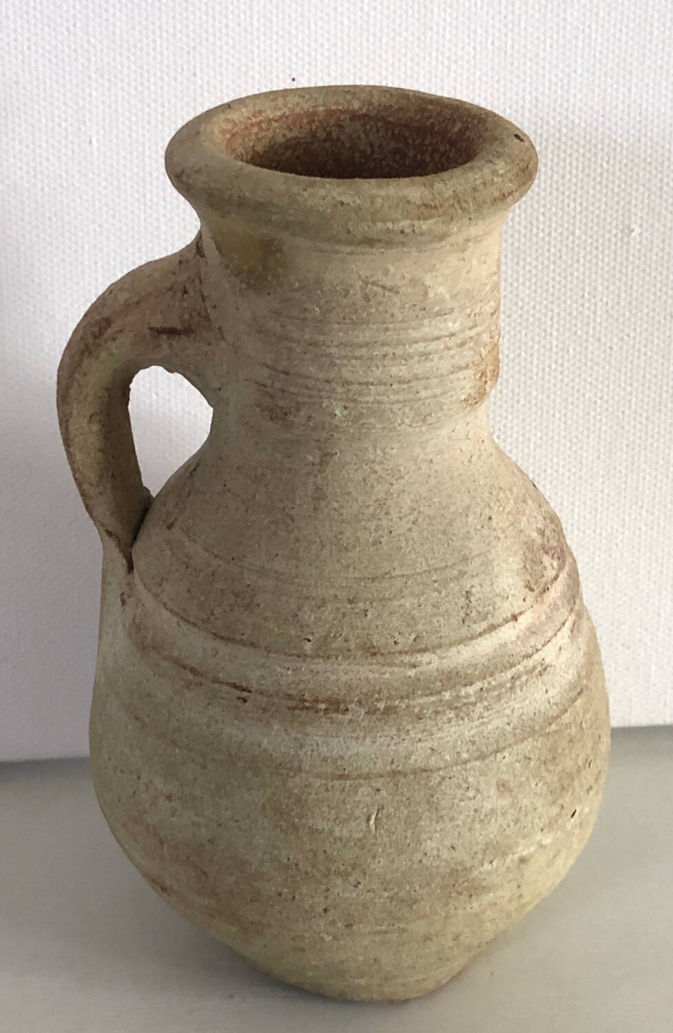 Beige terracotta jug