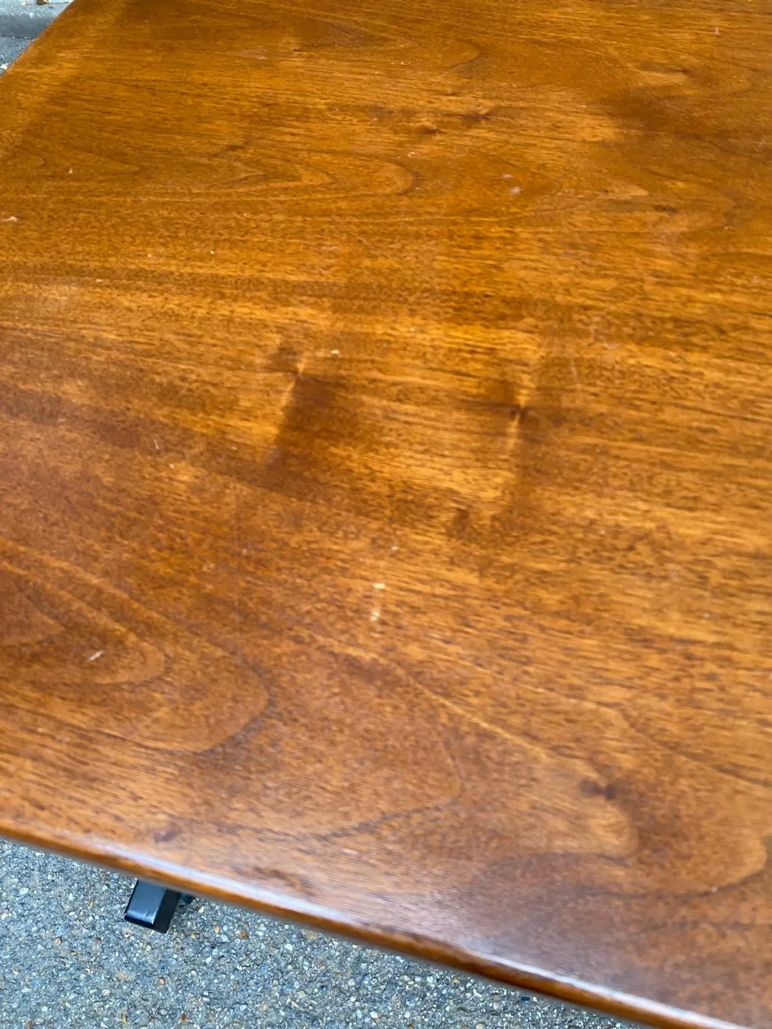 Small Scandinavian-style computer desk on wheels made of wood.