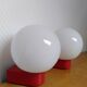 2 postmodern opaline and red metal wall lights, 1980