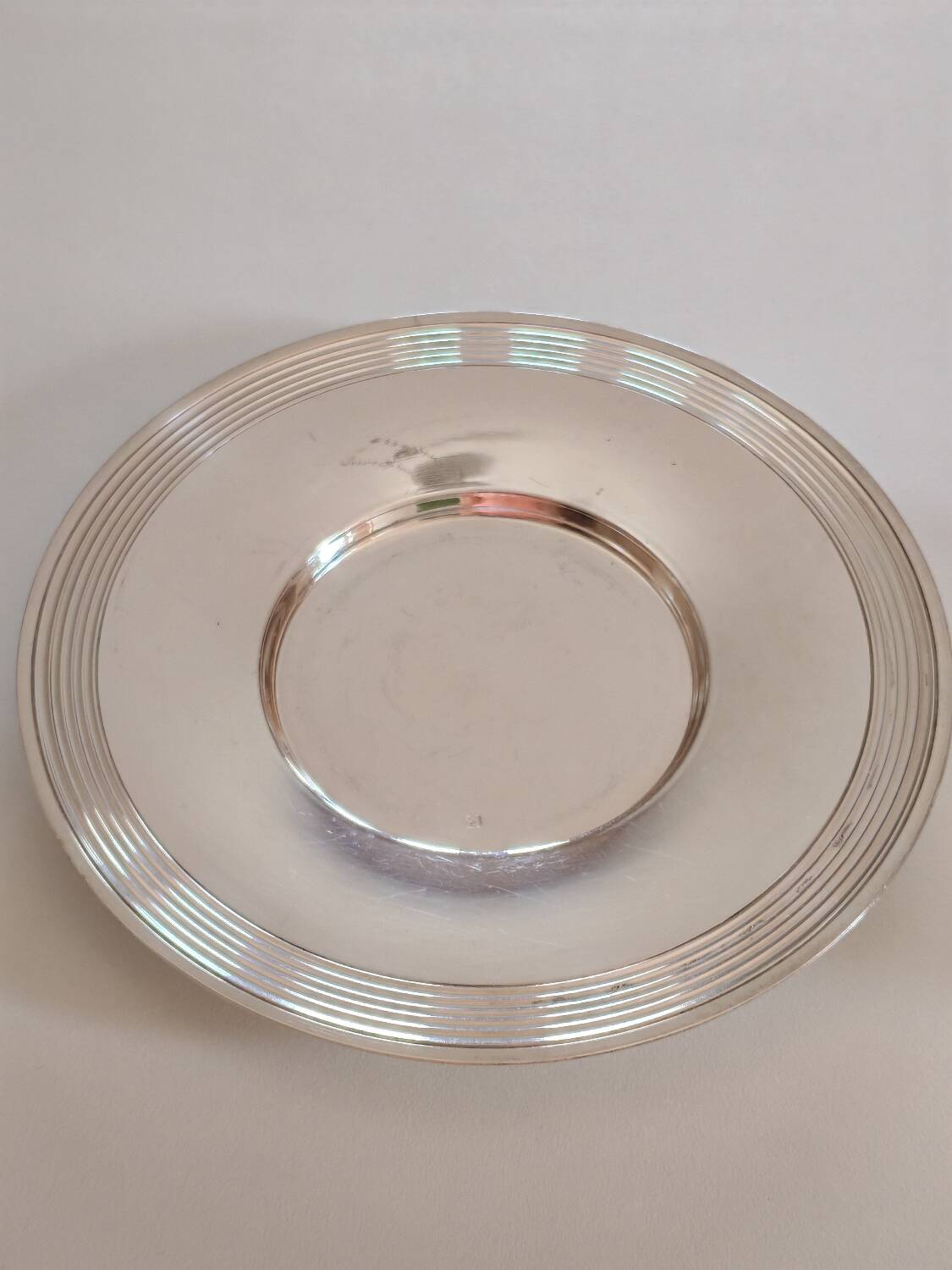 Silver-plated metal cup and saucer