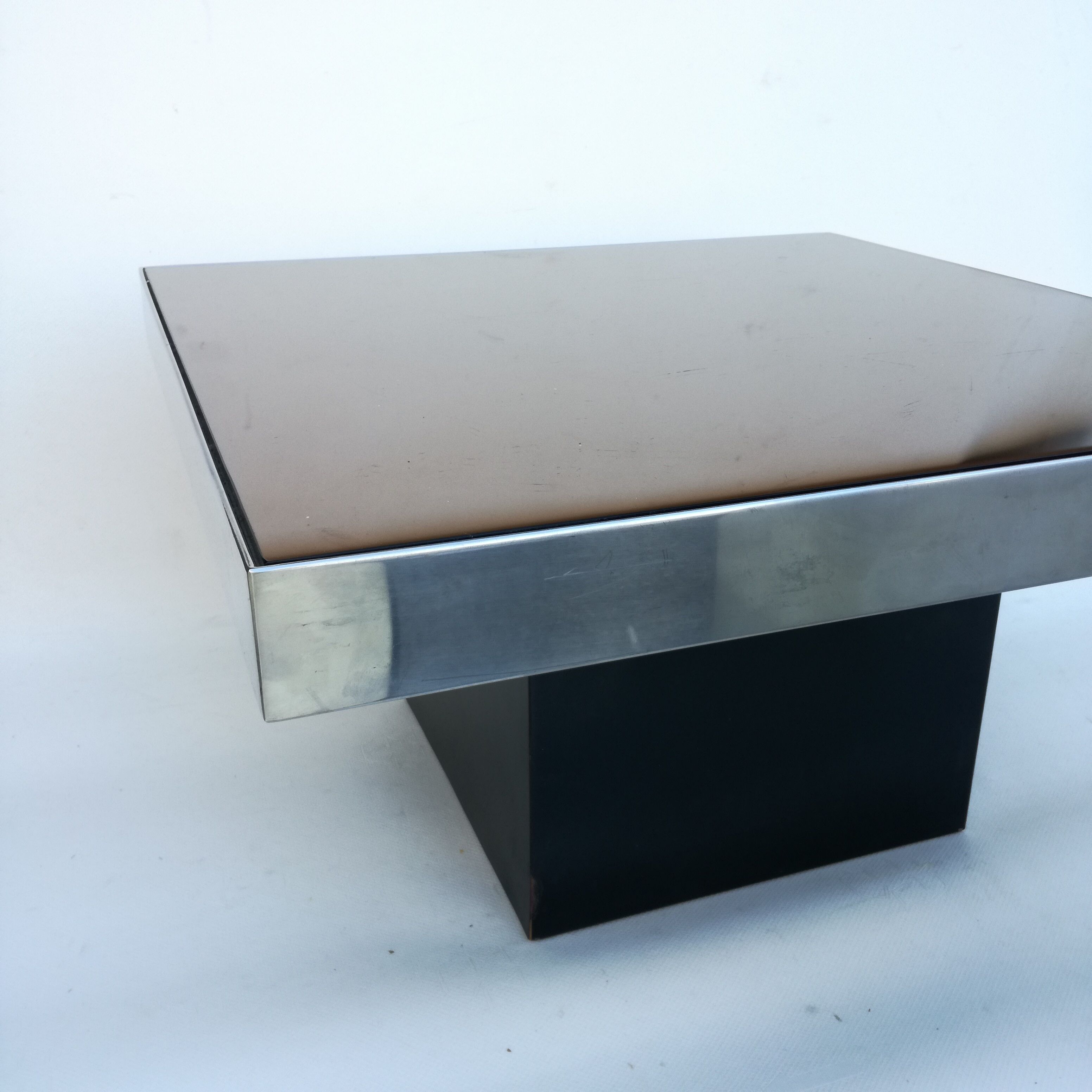 Square pedestal coffee table with mirror top
