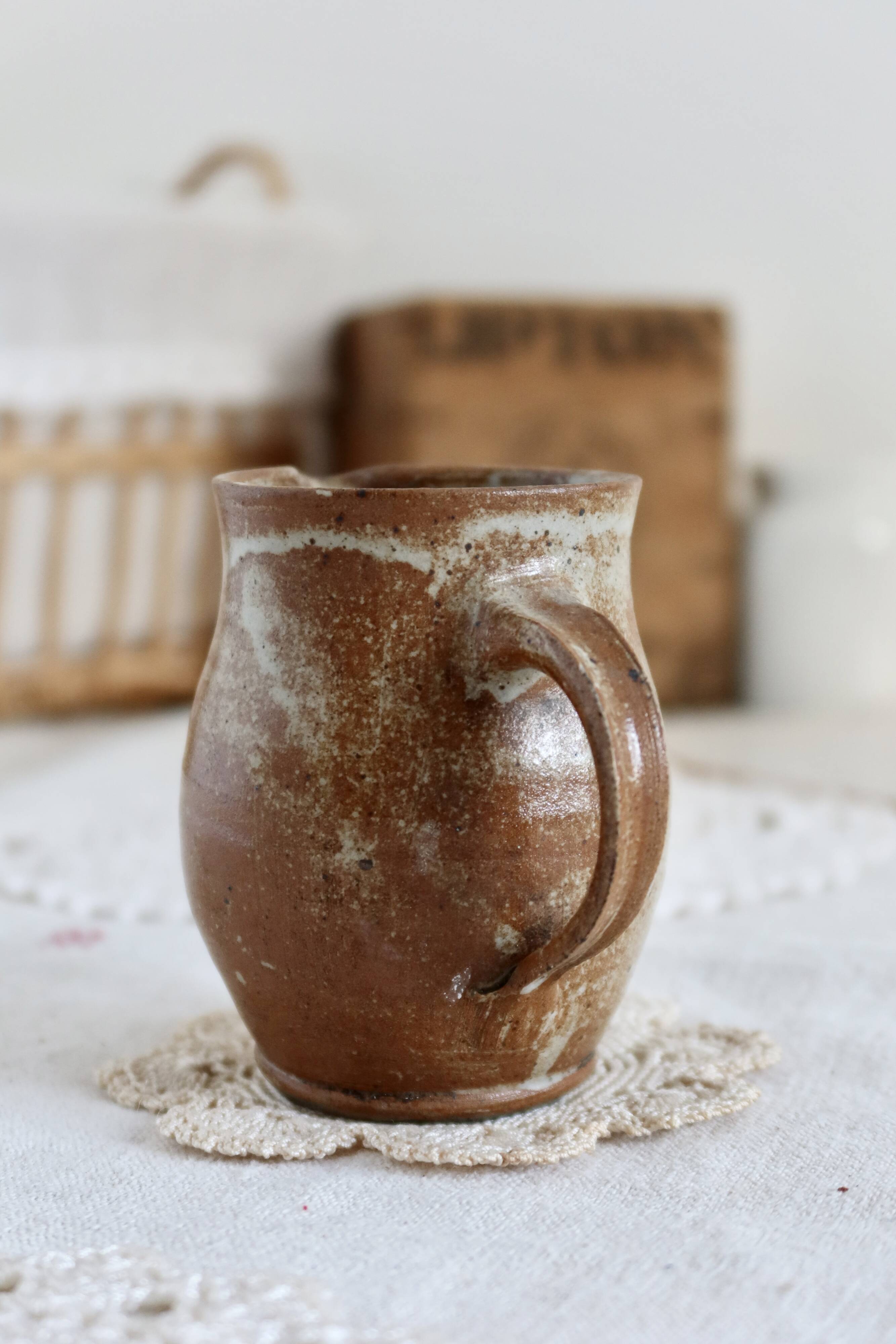 Small vintage hand turned ceramic milk jug with rustic glaze