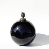 Old lamp foot shaped ball in black glass