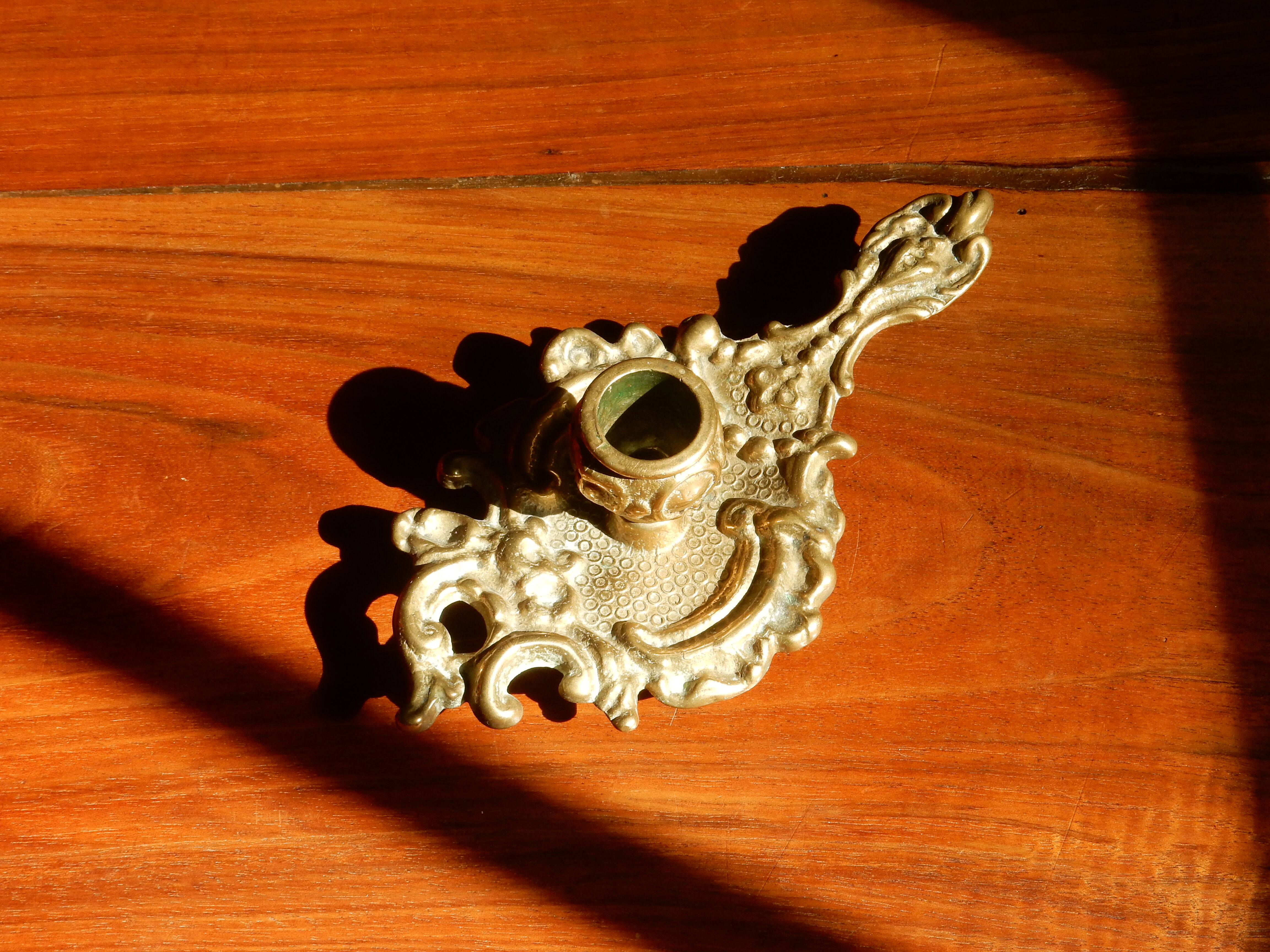 Bronze hand candle holder, cellar rat