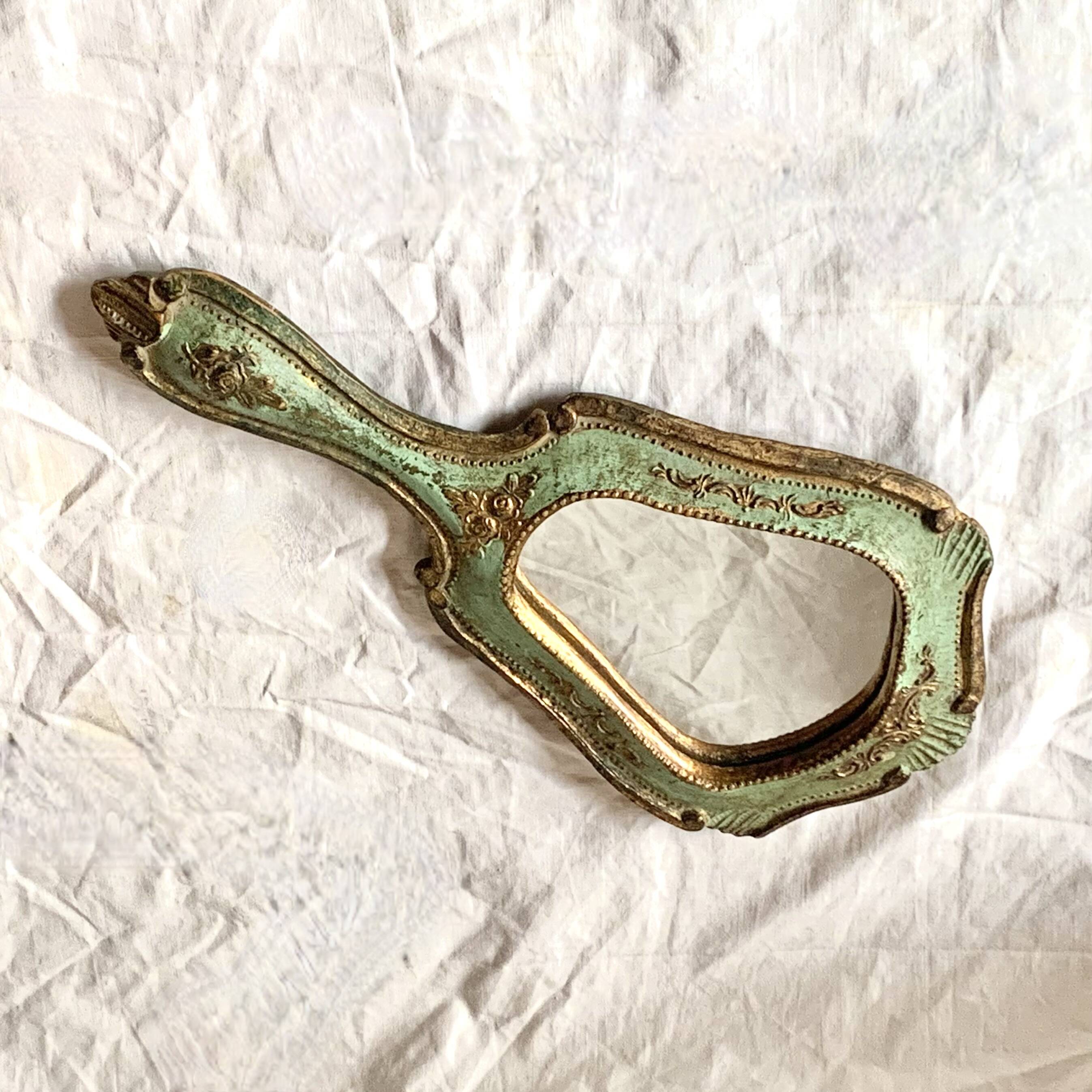 Old Florentine style carved wooden hand mirror