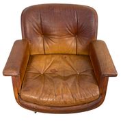Pair of vintage cognac leather swivel lounge chairs by Eugen Schmidt