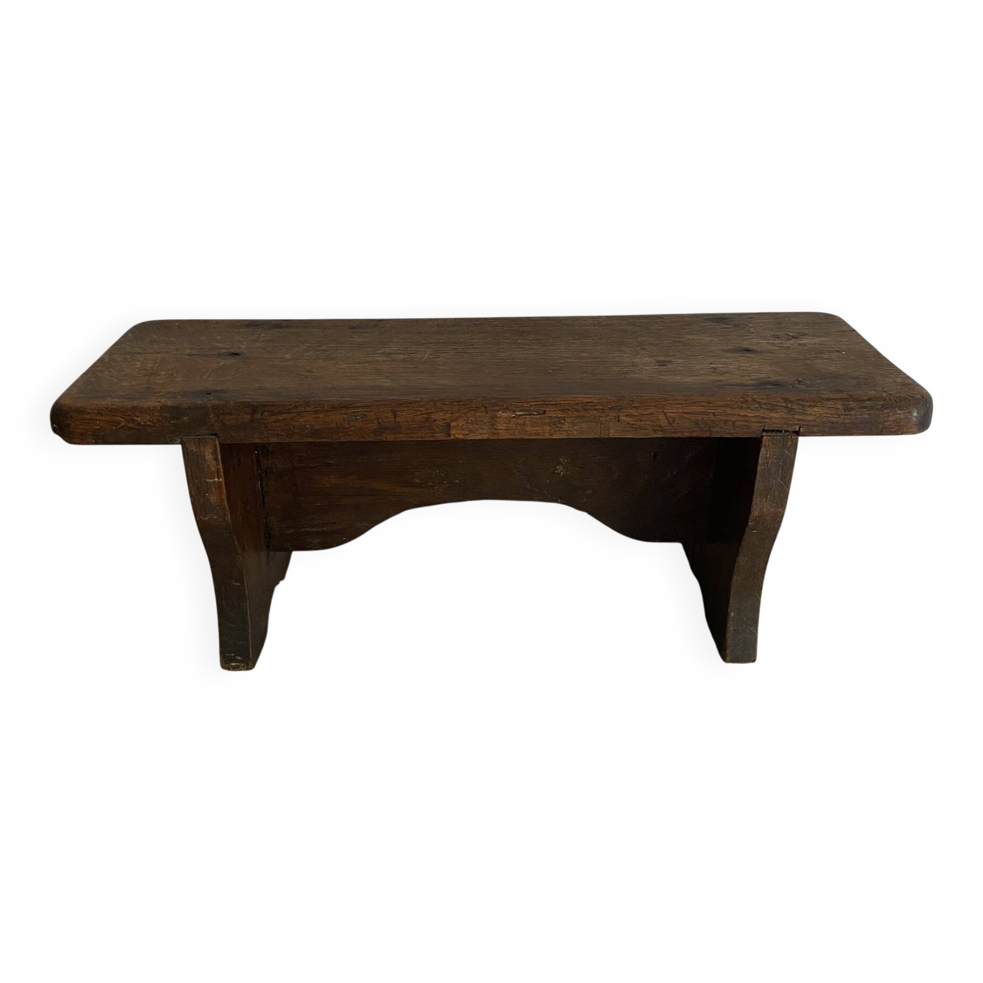 Old low stool made of solid wood