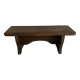 Old low stool made of solid wood