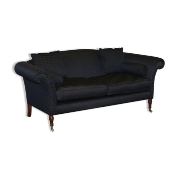 Three-seater Art Deco canapé with a light hardwood frame.