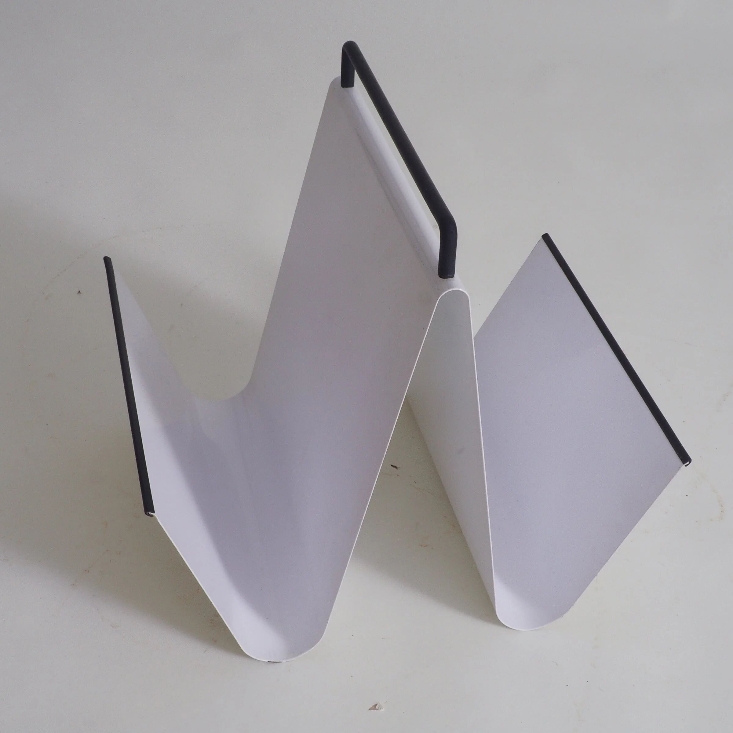 Metal magazine holder by Pete Sans for NRO