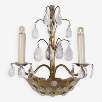 Brass floral wall lamp with tassels.