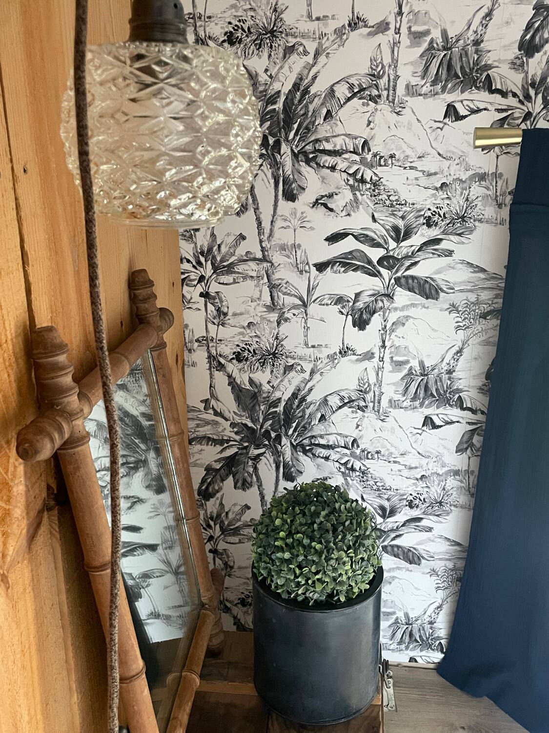 Carved wooden mirror in a bamboo style