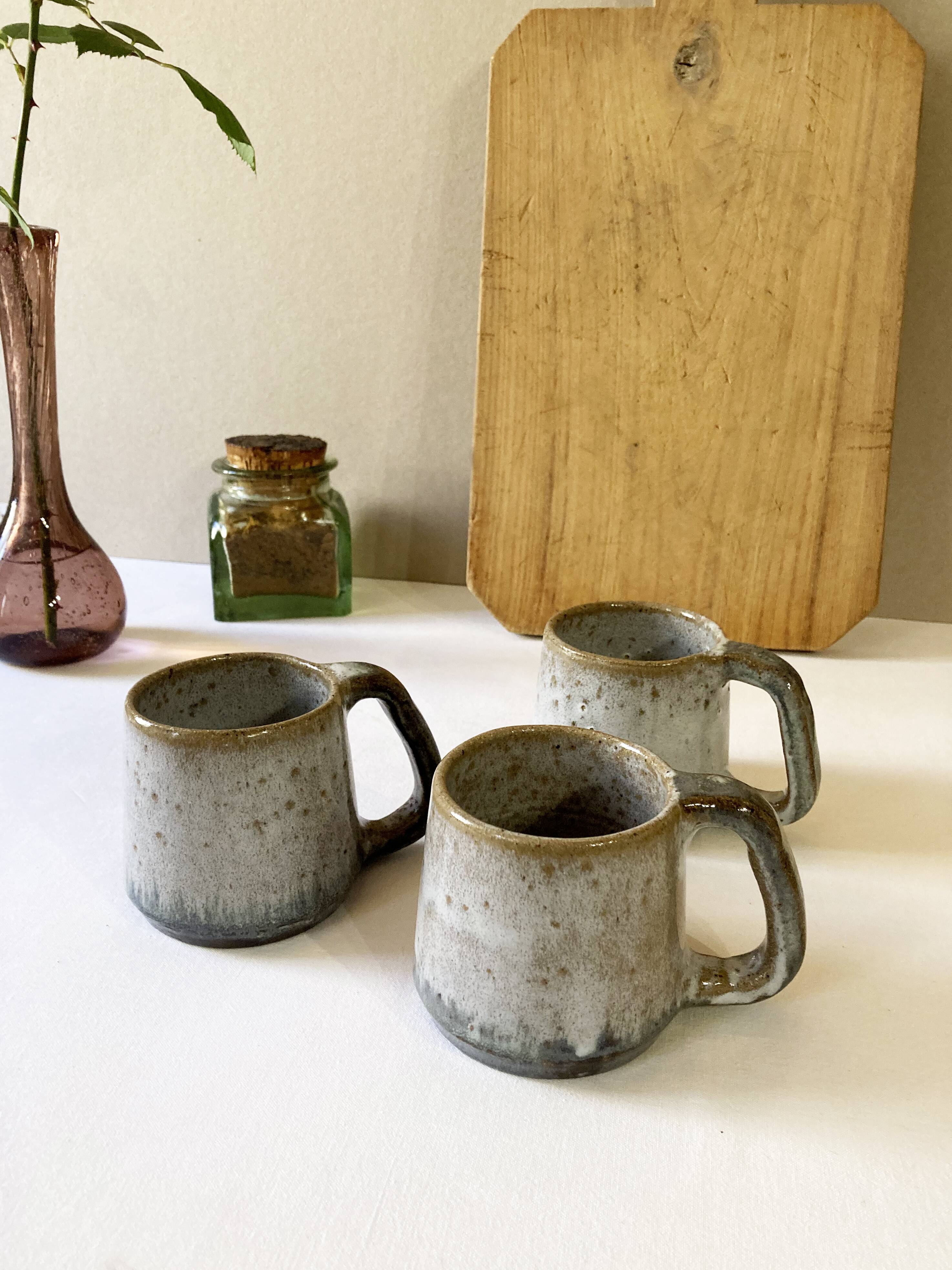 Trio of stoneware mugs