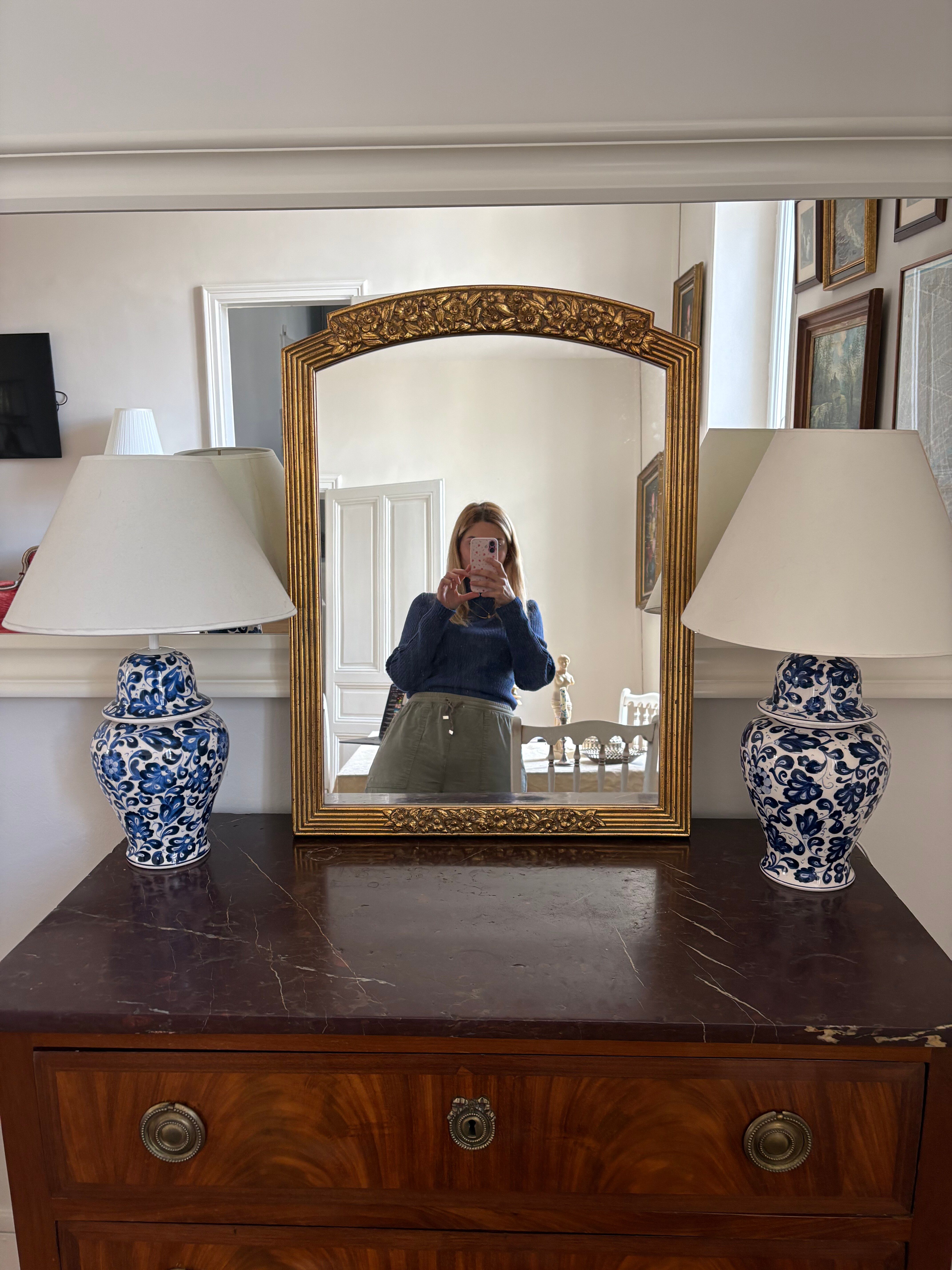 Large vintage gold mirror in Louis XVI style – fluted frame and floral decoration.