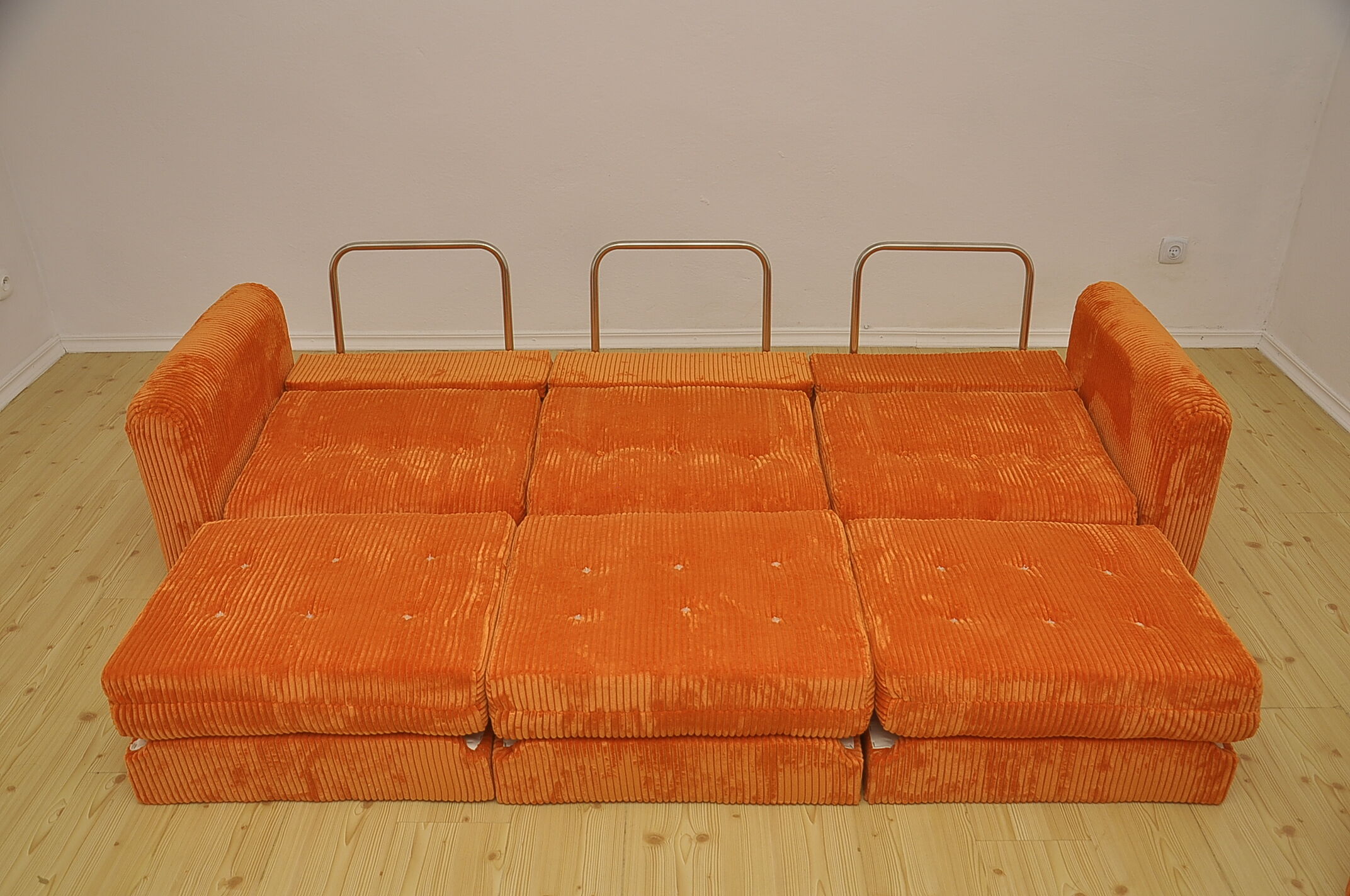 Orange corduroy modular sofa, 1970s.