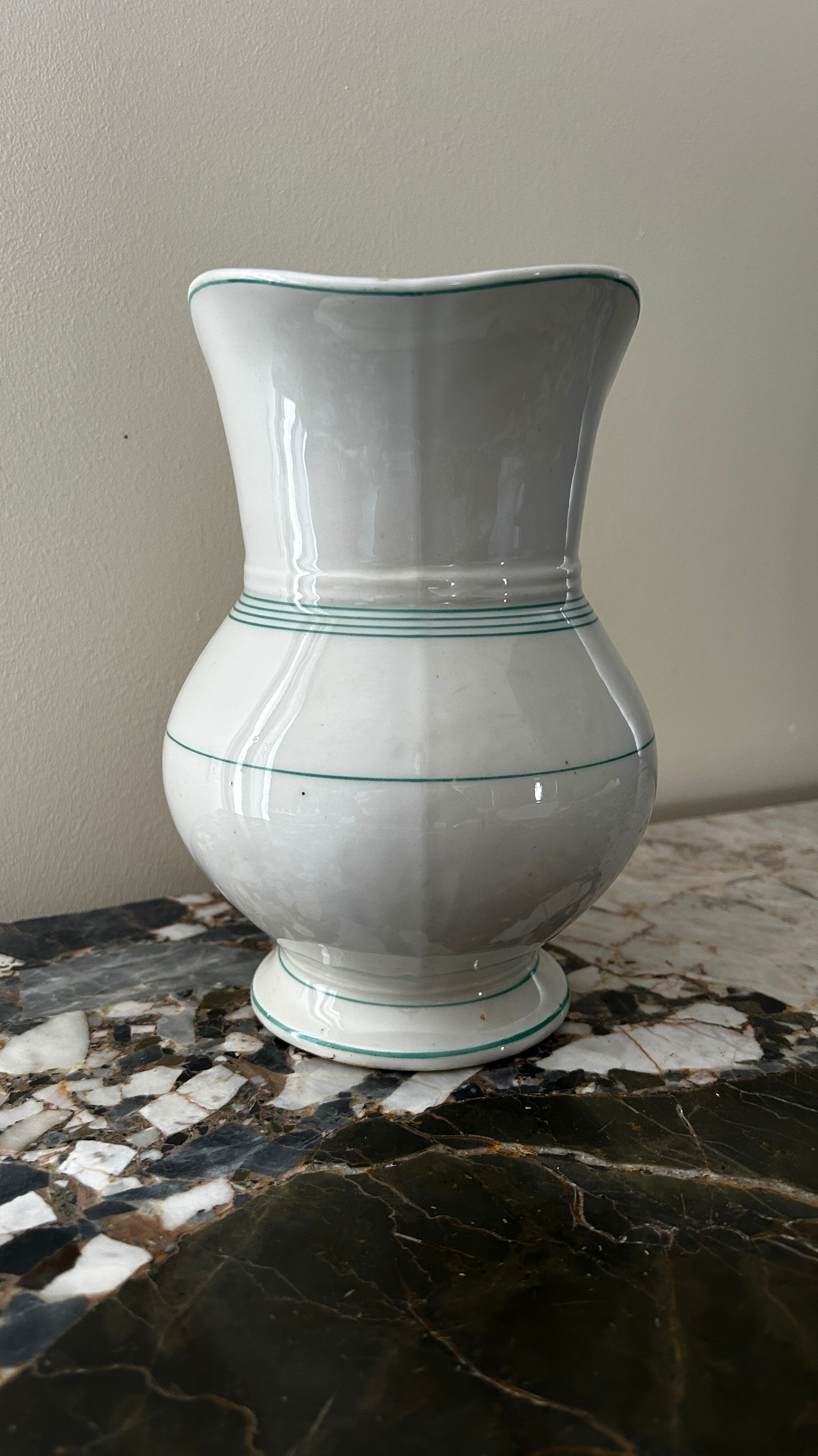 White toilet jug with green trim