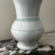 White toilet jug with green trim
