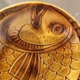 Vintage barbotine plates with fish decoration, 22 pieces.