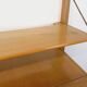 Wall shelf library with vintage light wood secretary bar