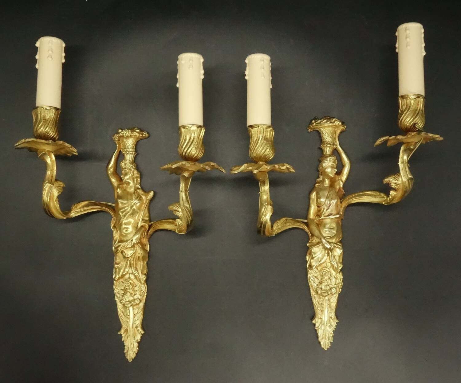 Pair of large caryatid wall sconces in Louis XV style from the 19th century - gilded bronze.