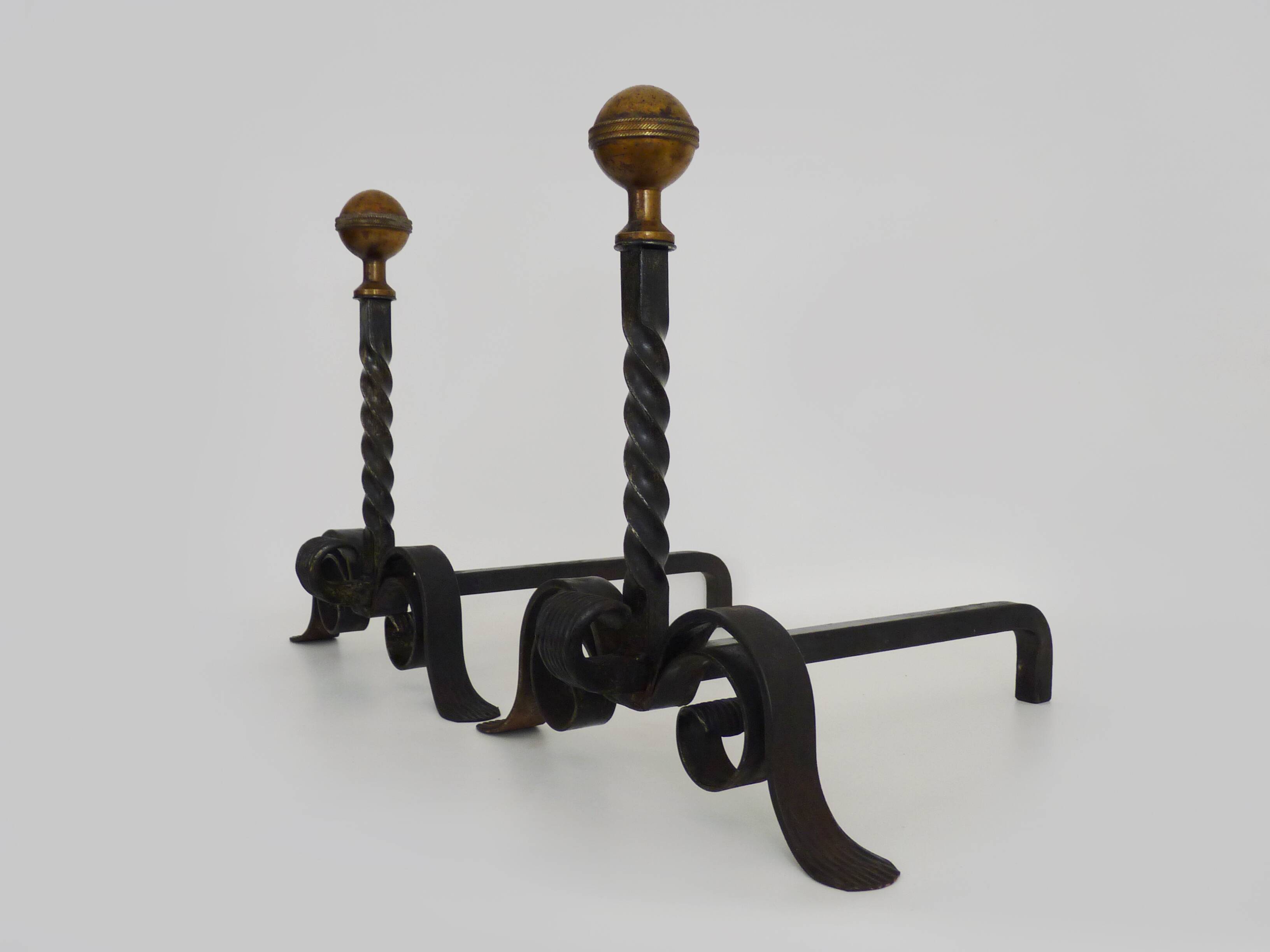 Large pair of wrought iron and brass ball fireplace andirons. 19th century