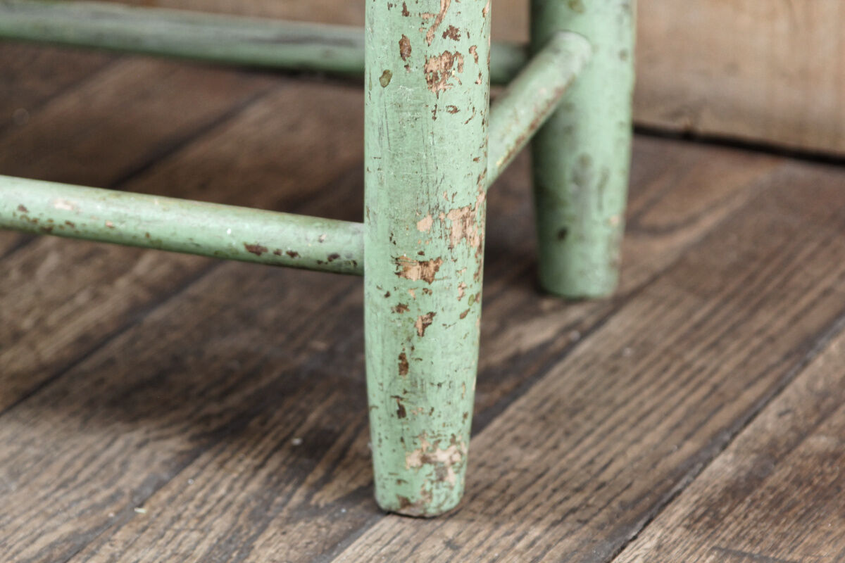 Old wooden and straw stool