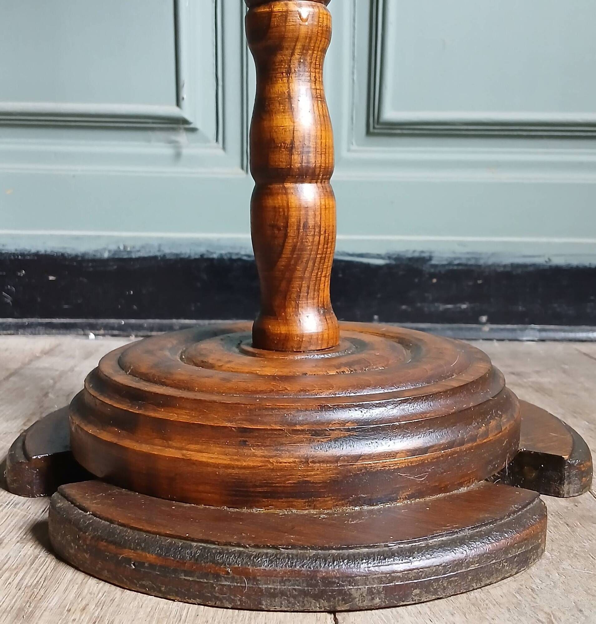 Turned solid wood side table stained with a quartz top.
