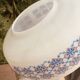 Suspension in opaline milk glass