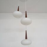 Set of three milk glass and teak pendant lights model NG74 by Louis Kalff for Philips, The Netherlan