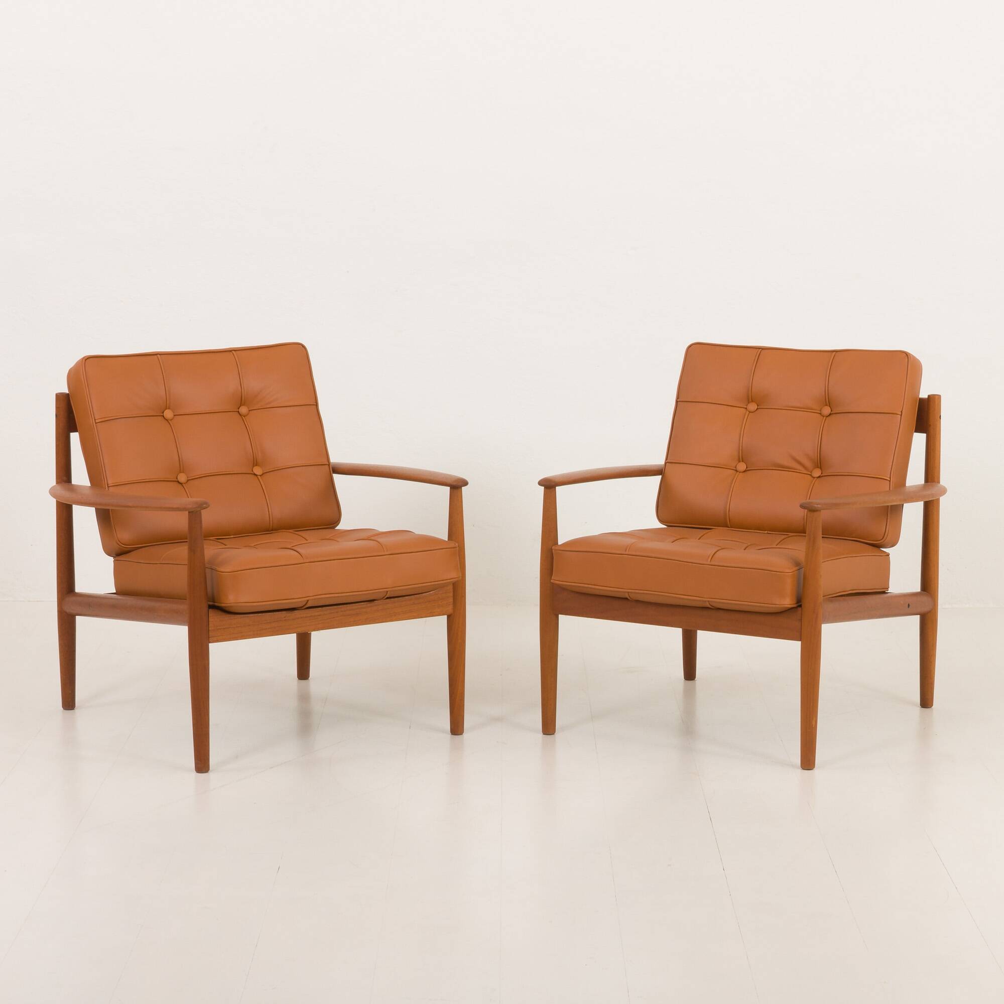 Rare Grete Jalk teak lounge chairs in aniline cognac leather for Cado