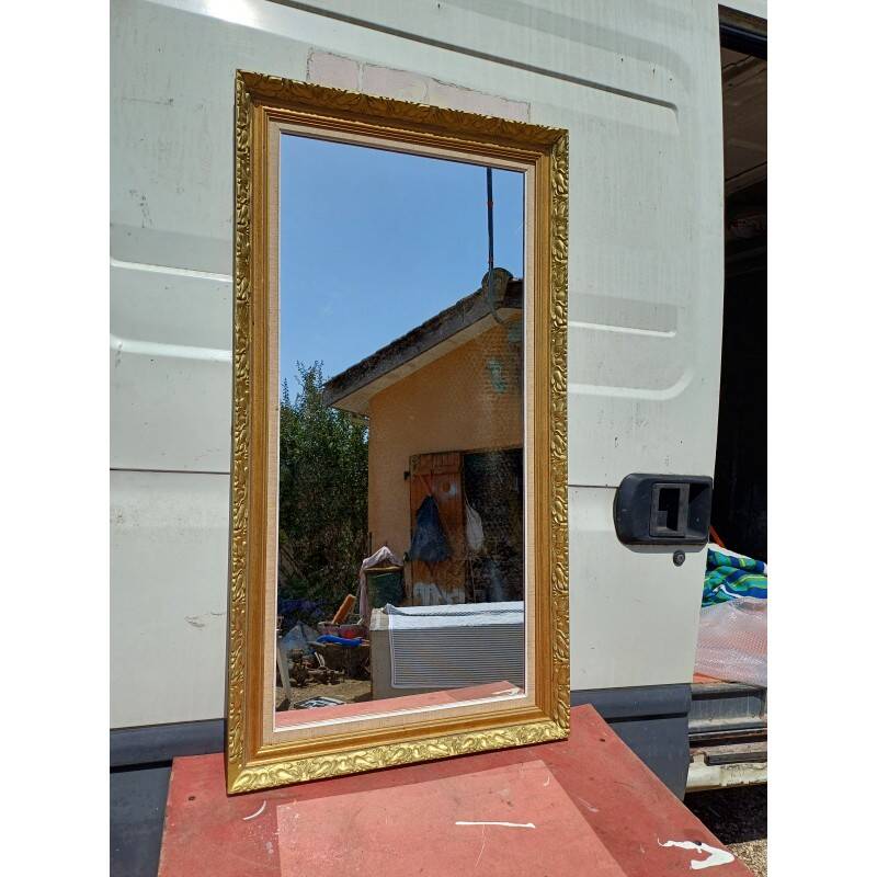 Wooden mirror and gold trim