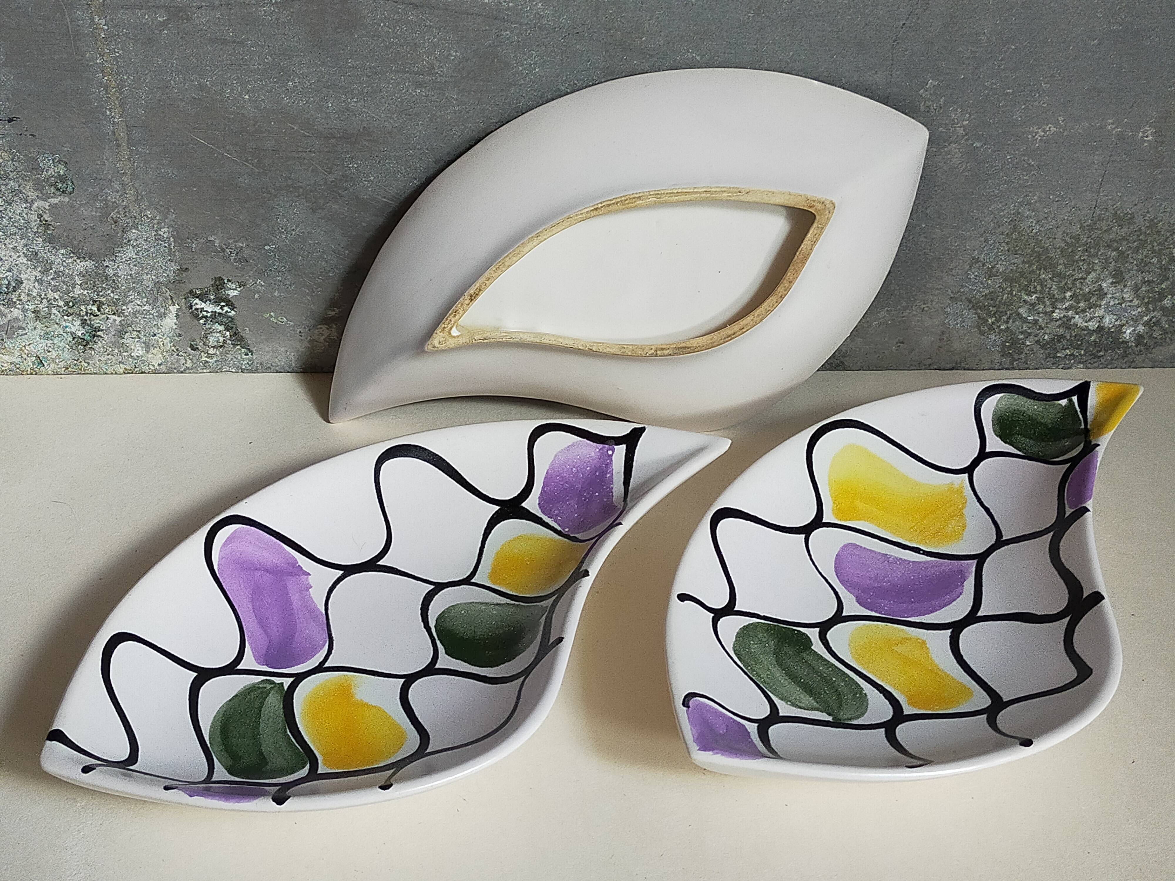 Three vintage free-form ceramic ravine dishes from the 1950s