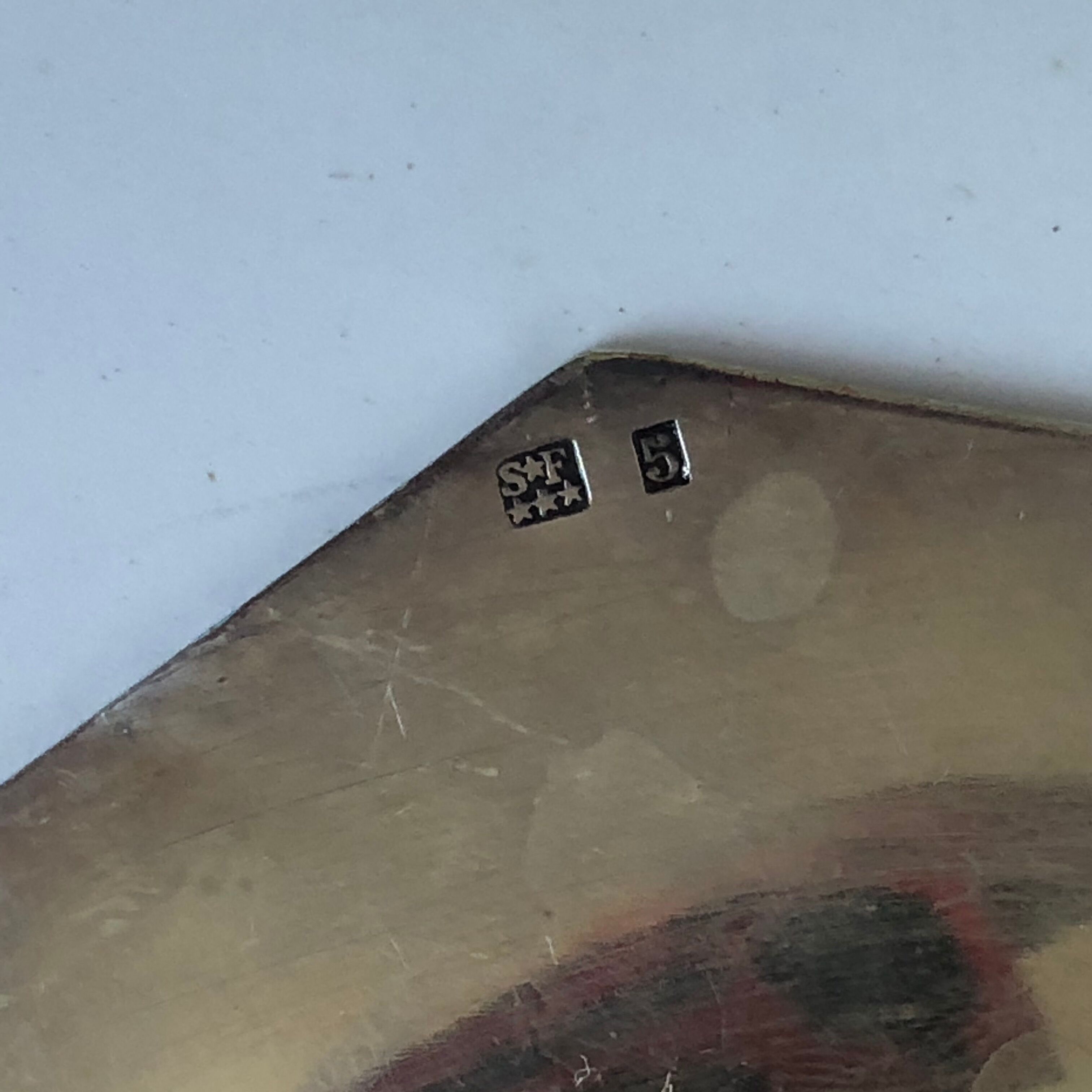 Set of three silver metal bottle bottoms