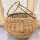 Panier boule en rotin tressé à anse