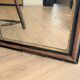 Miroir style Louis-Philippe en bois flammé noir et doré - 96 x 66 cm