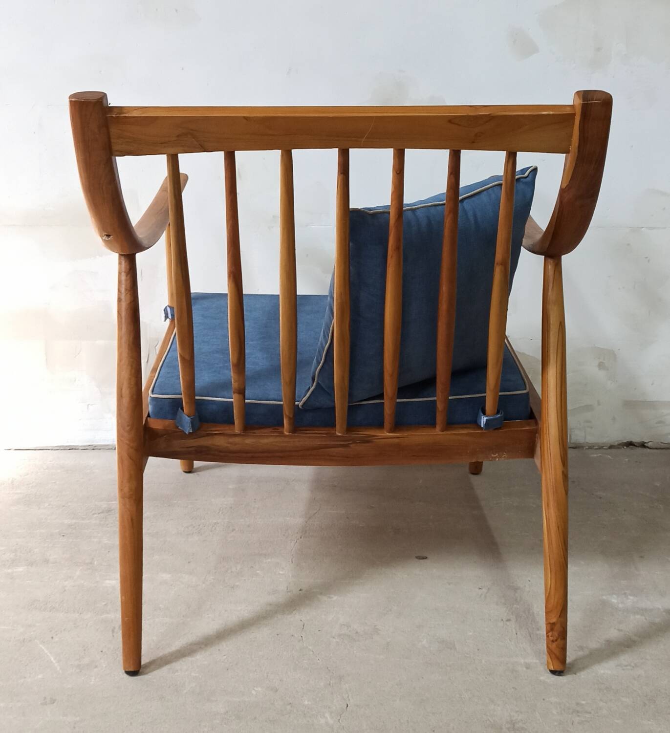 Pair of cozy teak armchairs with cushions